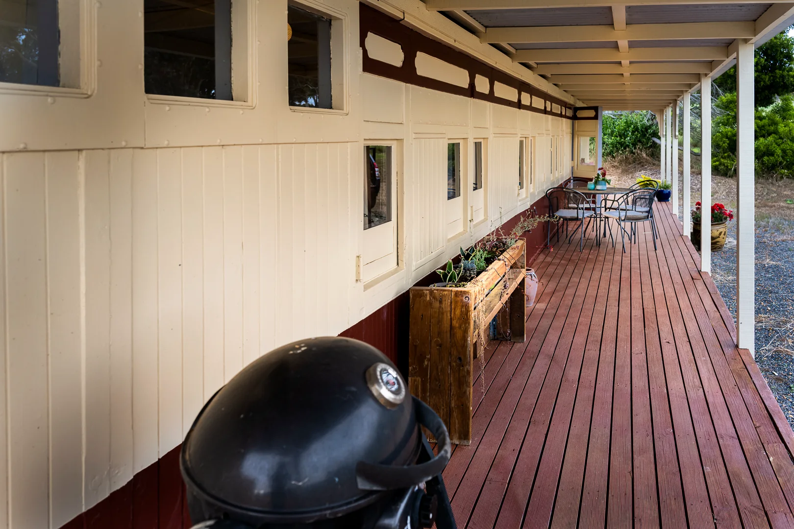 Long sheltered verandah beside the carriage