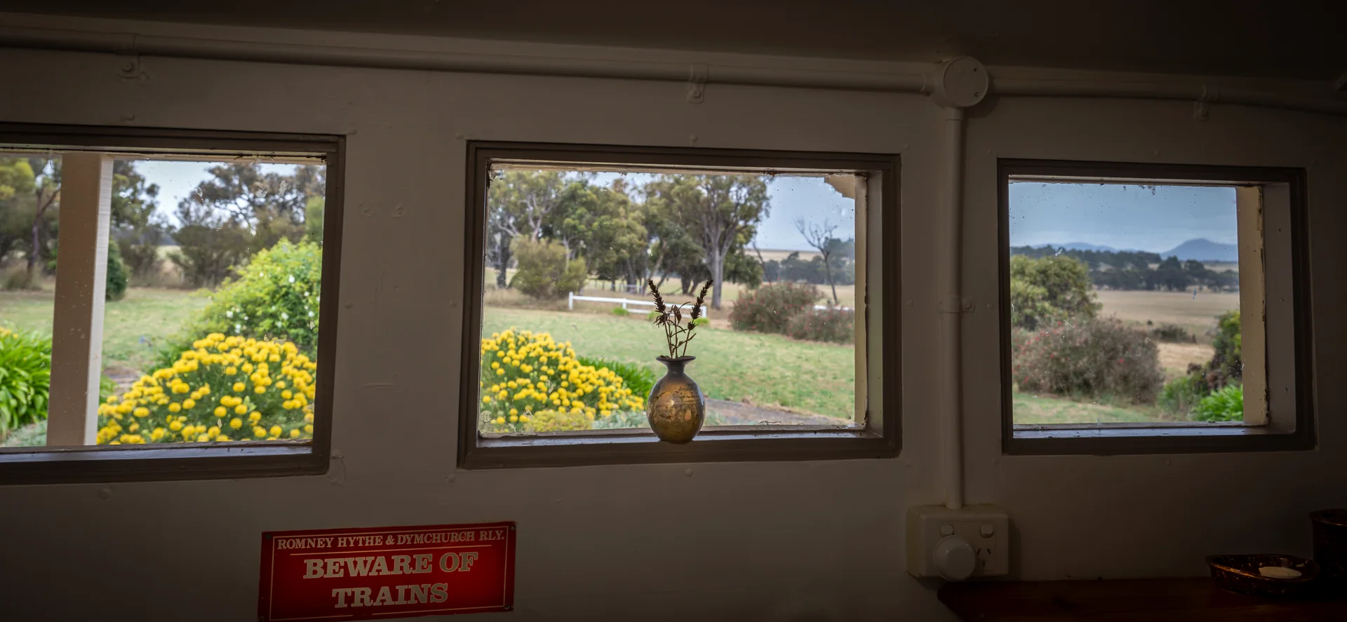 Country garden and paddock view through the carriage windows